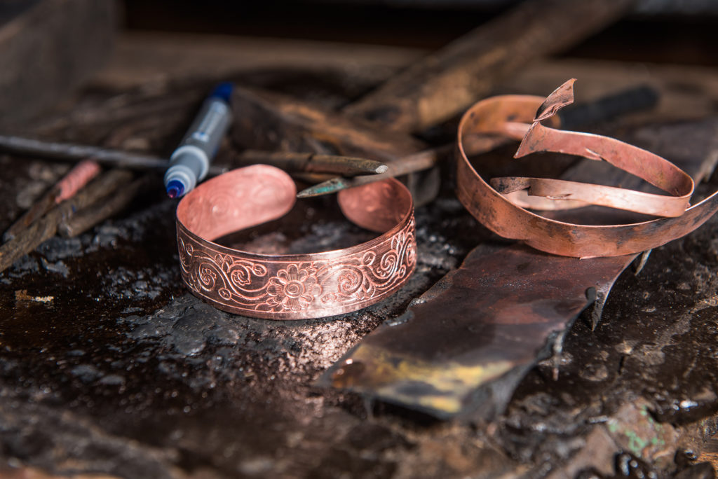 Copper bracelet carving workshop in Siem Reap, Cambodia